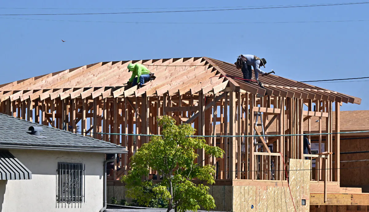 Construction workers work on the roof of a house being built in Alhambra, Calif., on Sept. 23, 2024. (Frederic J. Brown/AFP via Getty Images)