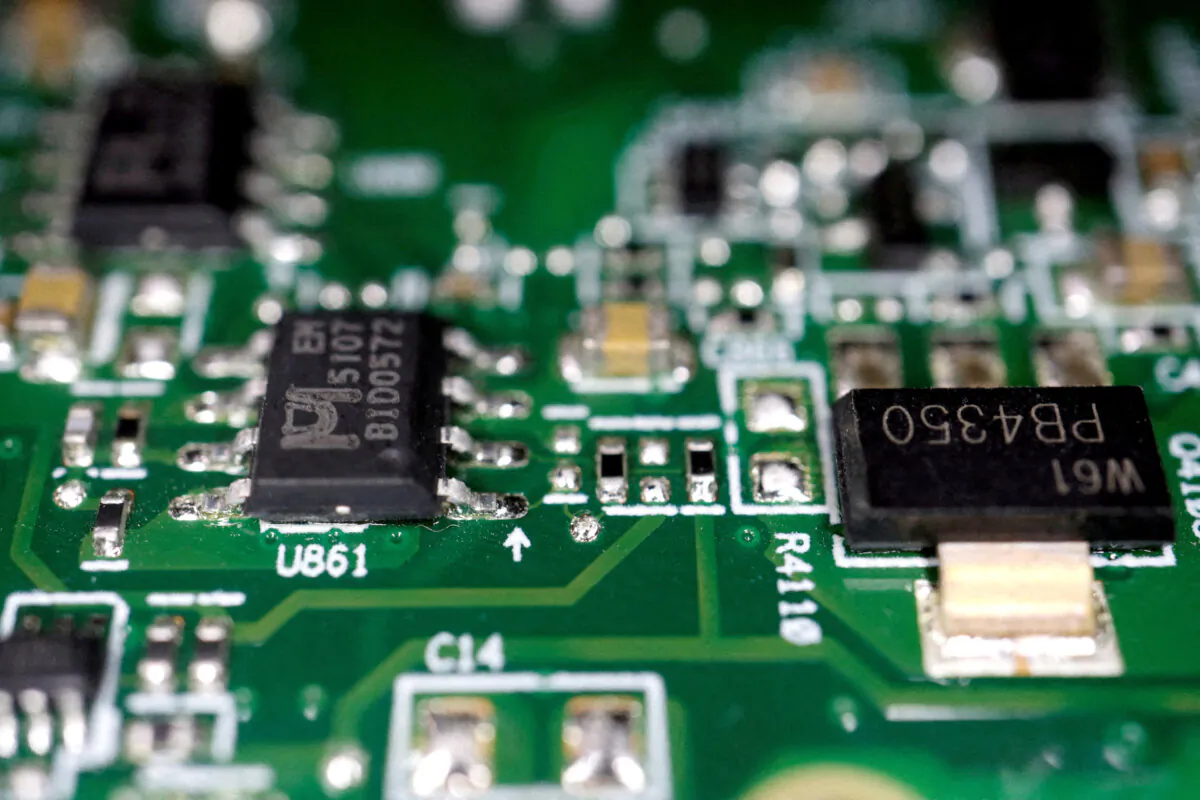Semiconductor chips on a printed circuit board, in this illustration picture taken on Feb. 17, 2023. (Florence Lo/Reuters)