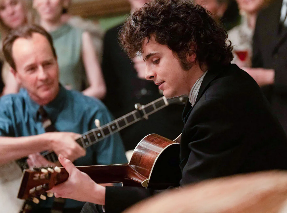 Bob Dylan (Timothée Chalamet, R) and Pete Seeger (Edward Norton), in "A Complete Unknown." (Searchlight Pictures)