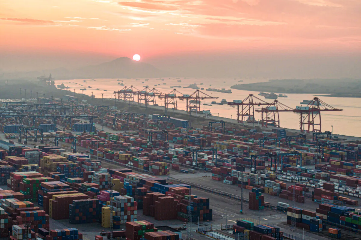 Shipping containers stacked during the sunset at Nanjing port, Jiangsu Province, China on Jan. 4, 2024. (STR/AFP via Getty Images)