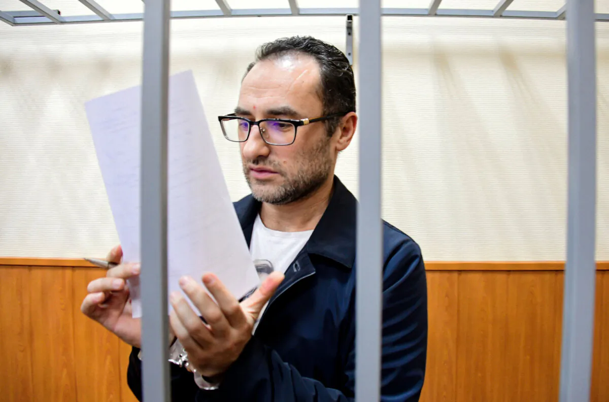 Eugene Spector stands behind bars in a courtroom in Moscow, Russia, on Feb. 20, 2020. (Igor' Ivanko/Kommersant Publishing House via AP)