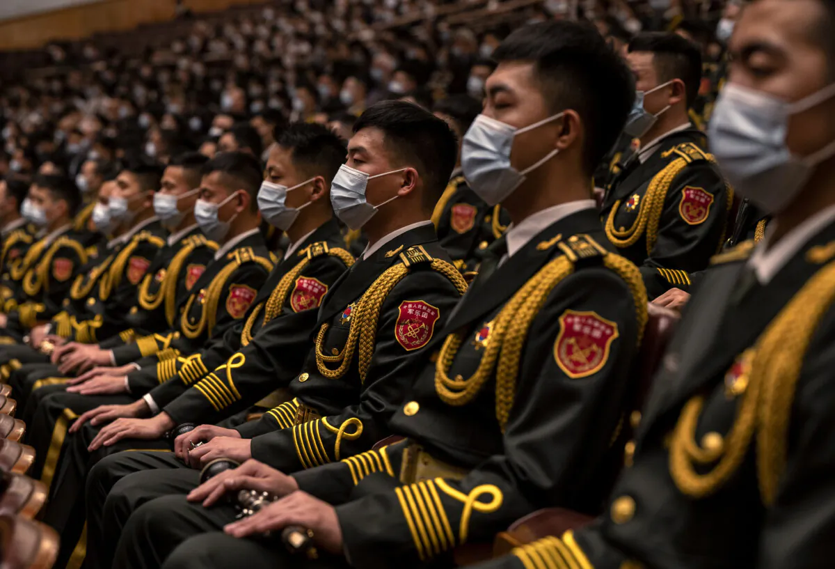 Members of the Peoples Liberation Army band are seated during the Opening Ceremony of the 20th National Congress of the Communist Party of China in Beijing on Oct. 16, 2022. (Kevin Frayer/Getty Images)