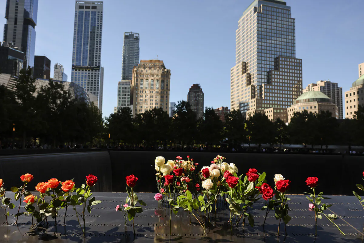Flowers on names of victims of the 9/11 terrorist attack during the annual 9/11 Commemoration Ceremony at the National 9/11 Memorial and Museum in New York City on Sept. 11, 2024. (Michael M. Santiago/Getty Images)