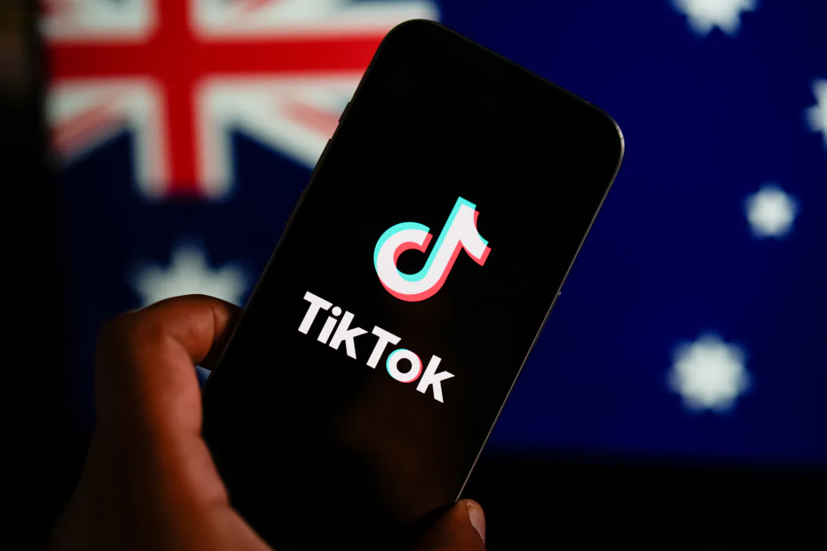 In this photo illustration, the TikTok logo is displayed on a phone screen with the Australian flag displayed in the background in Melbourne, Australia on Nov. 30, 2024. (Asanka Ratnayake/Getty Images)