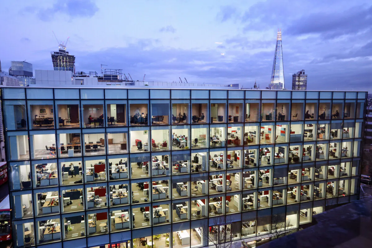 People work in an office development. (Oli Scarff/Getty Images)