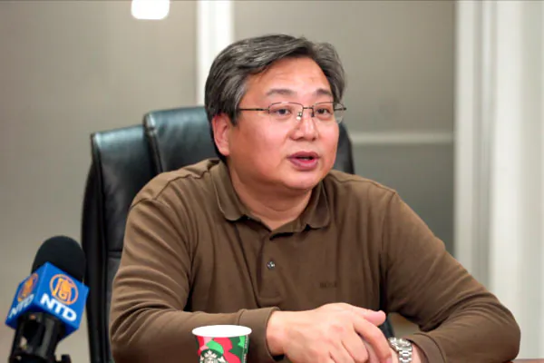 Du Wen, former executive director of the Legal Advisory Office of the Inner Mongolia Autonomous Region Government in China, during an interview with The Epoch Times on Dec. 16, 2024. (NTD TV)