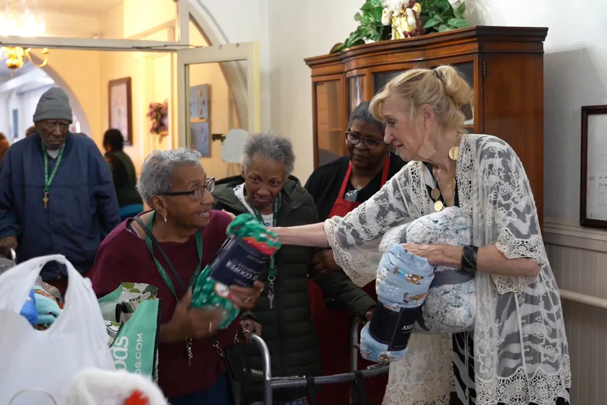 The “Happy Flower Lady” Patricia Gallagher has brought warmth and comfort to thousands through her unique project of delivering blankets to seniors, in Philadelphia on Dec. 18, 2024. (William Huang/The Epoch Times)