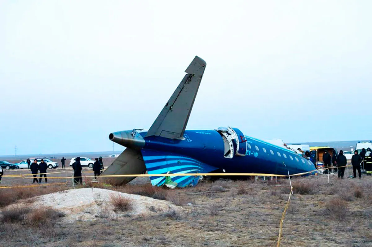 In this photo taken from a video released by the administration of Mangystau region, a part of Azerbaijan Airlines' Embraer 190 lies on the ground near the airport of Aktau, Kazakhstan, on Dec. 26, 2024. (The Administration of Mangystau Region via AP)