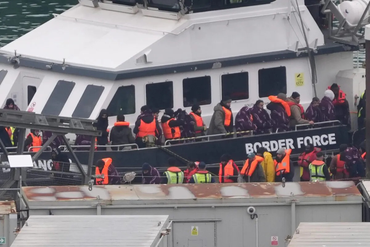 A group of people thought to be illegal immigrants are brought in to Dover, Kent, from a Border Force vessel following a small boat incident in the Channel on Dec. 26, 2024. (Gareth Fuller/PA)