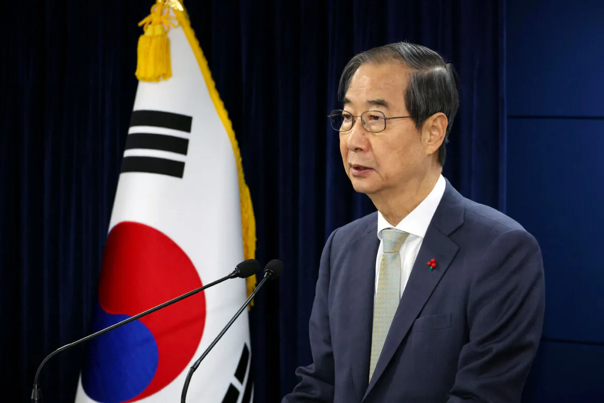 Acting South Korean President and Prime Minister Han Duck-soo delivers an address to the nation at the government complex in Seoul, South Korea, December 14, 2024. Yonhap via REUTERS/File Photo