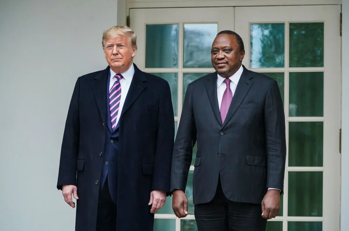 U.S. President Donald Trump (L) walks with Kenyan President Uhuru Kenyatta on the White House colonnade as they make their way to the Oval Office on Feb. 6, 2020. (Drew Angerer/Getty Images)