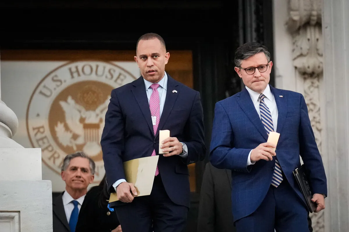 (L-R) House Minority Leader Hakeem Jeffries (D-N.Y.) and Speaker of the House Mike Johnson (R-La.) at a bipartisan candlelight vigil at the U.S. Capitol on Nov. 7, 2023. (Drew Angerer/Getty Images)