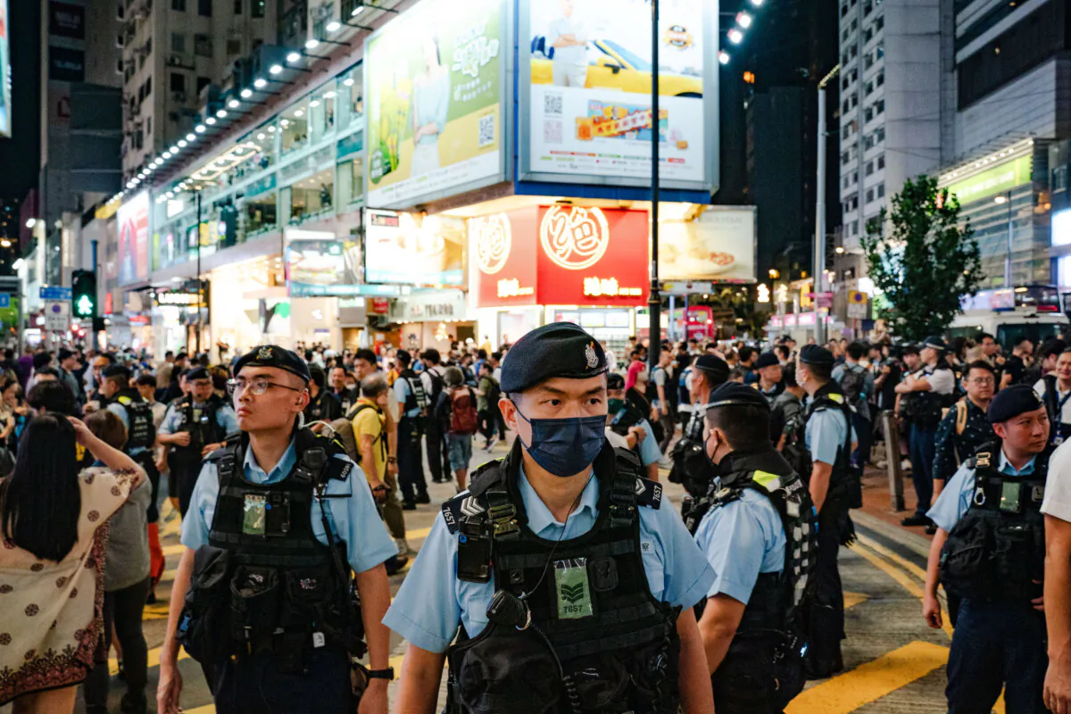 Police officers patrol at the Causeway Bay district nearby Victoria Park where people traditionally gathered annually to mourn the victims of China's Tiananmen Square massacre in 1989 in Hong Kong on June 4, 2024. Nearby Victoria Park had been the site of an annual remembrance of the massacre, but since the new national security law has gone into effect, the event no longer takes place. (Anthony Kwan/Getty Images)