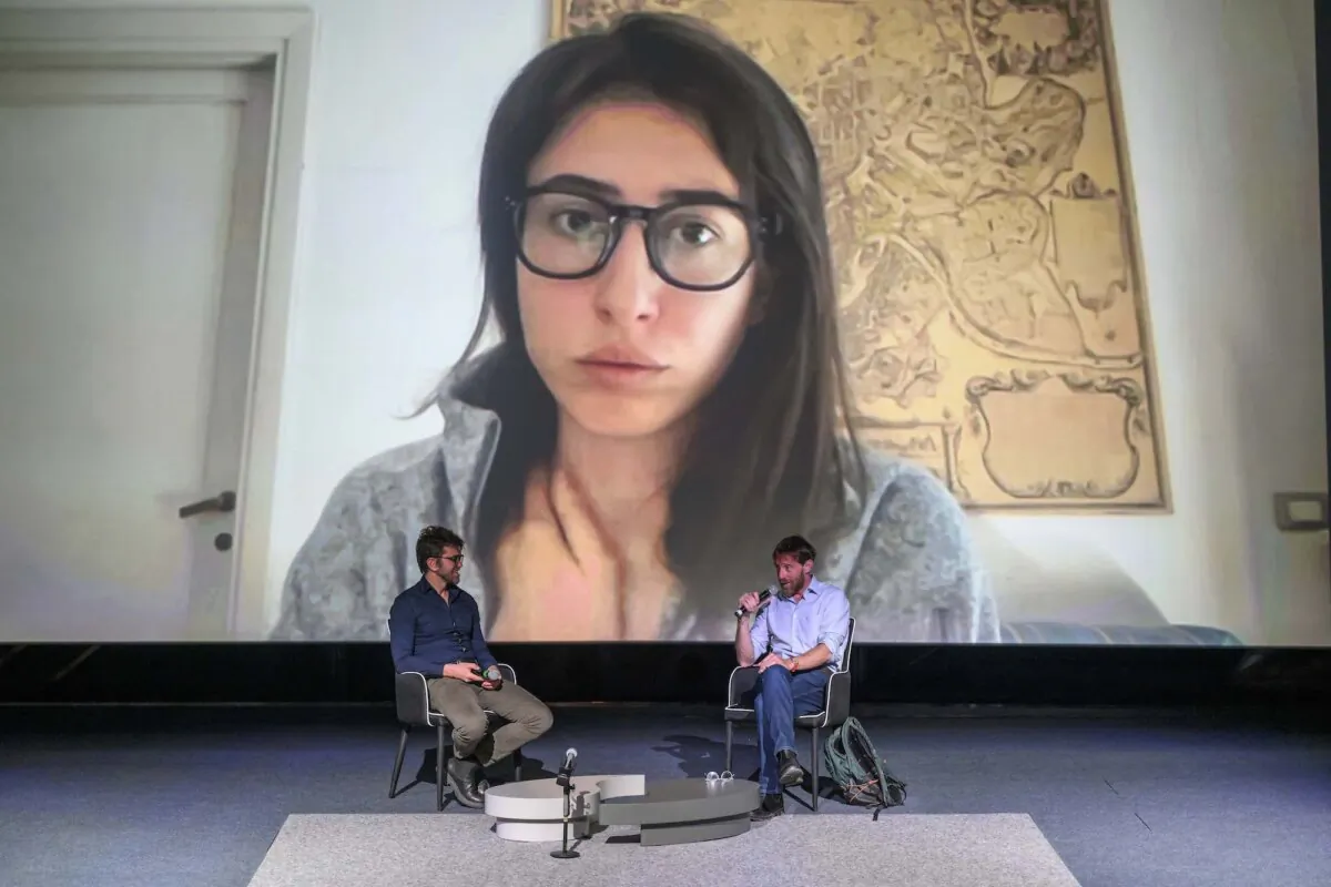 Alessio Romenzi, Sergio Splendore, and Cecilia Sala (via video link) during the “Gli orrori della guerra: storie dal fronte” event as part of the Terni Influencer & Creator Festival 2024 in Terni, Italy, on April 13, 2024. (Antonio Masiello/Getty Images)