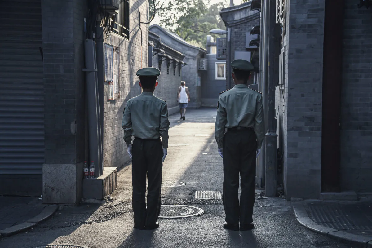 Chinese paramilitary police guard an alley in a street next to Tiananmen Square in Beijing on Sept. 7, 2019. (Greg Baker/AFP via Getty Images)