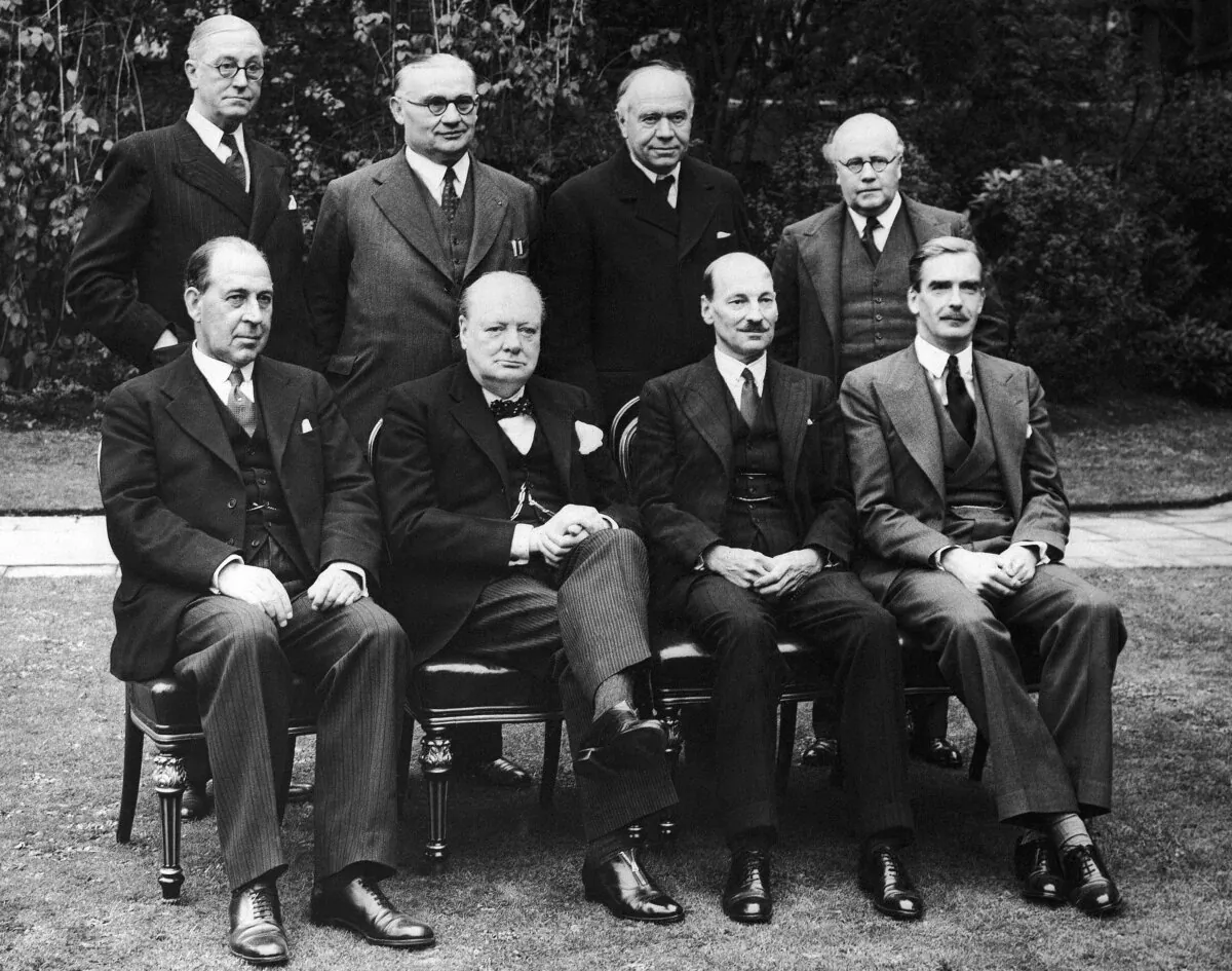 The War Cabinet at No. 10 Downing Street in London on Oct. 15, 1941. Standing second from right in the back row is Lord Beaverbrook, Minister of Aircraft Production, while Prime Minister Winston Churchill is seated second from left in the front row. (AP Photo/File)