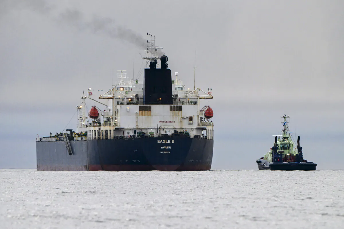 Oil tanker Eagle S (L), which flies under the flag of the Cook Islands, next to tugboat Ukko (R) off Porkkalanniemi, Kirkkonummi, in the Gulf of Finland on Dec. 28, 2024. (Jussi Nukari/Lehtikuva/AFP via Getty Images)