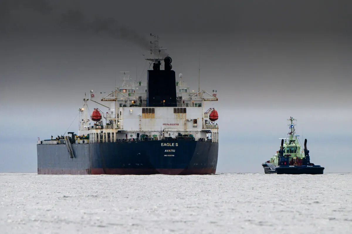 A photo taken on Dec. 28, 2024, off Porkkalanniemi, Kirkkonummi, in the Gulf of Finland, shows oil tanker Eagle S (L), which flies under the flag of the Cook Islands, next to tugboat Ukko (R). (Jussi Nukari/Lehtikuva/AFP via Getty Images)