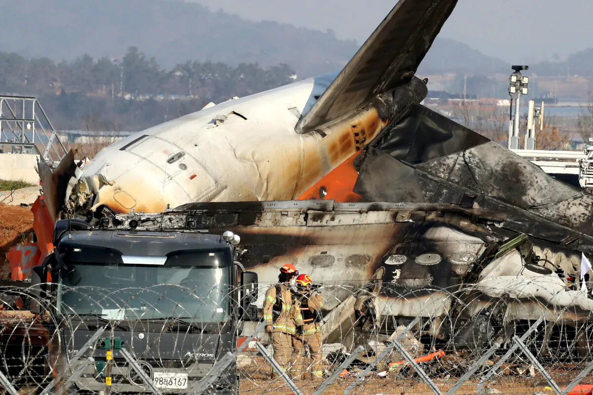 Firefighters and rescue teams work at the wreckage of a passenger plane at Muan International Airport in Muan-gun, South Korea, on Dec. 29, 2024. (Chung Sung-Jun/Getty Images)