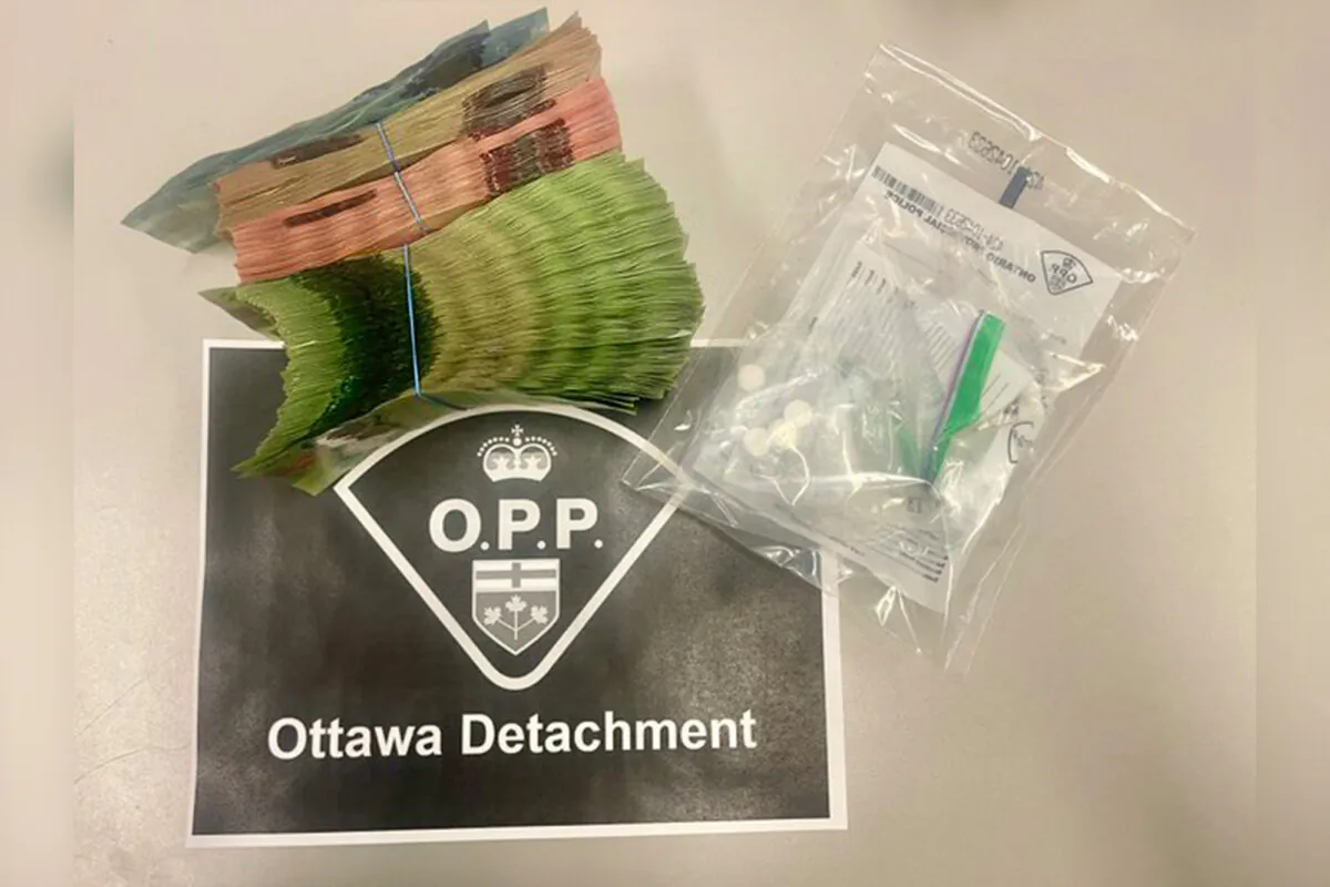 Ontario Provincial Police seized $28,000 in cash along with suspected drug tablets during a highway traffic stop after receiving a call about an impaired driver, in Ottawa on Dec. 28, 2024. (Courtesy of OPP/X)
