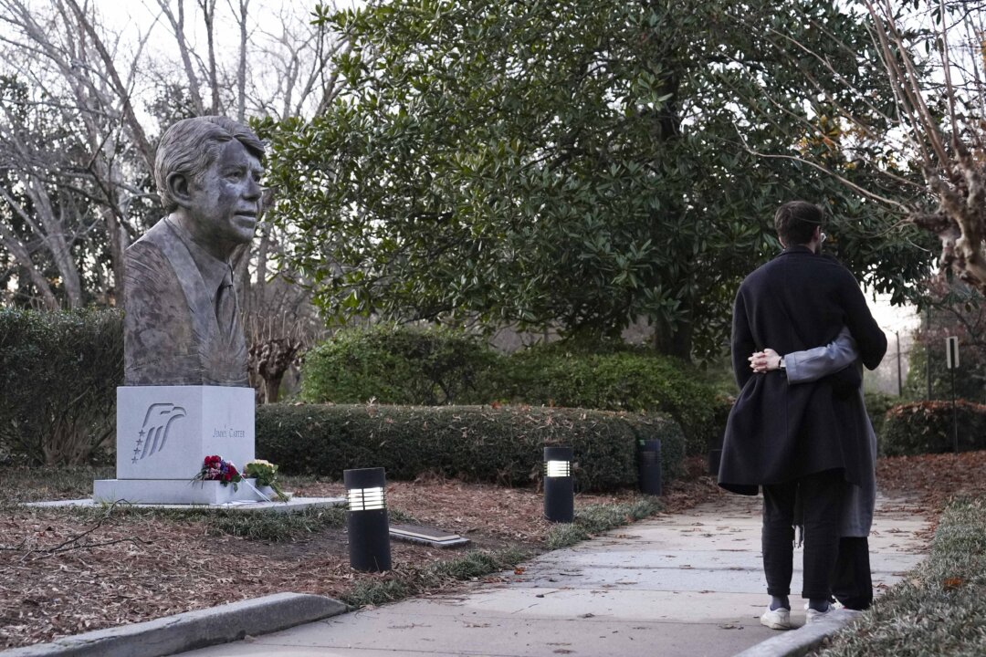 Day in Photos: Jimmy Carter Dies at 100, Plane Crash in South Korea, and Unrest in Valencia