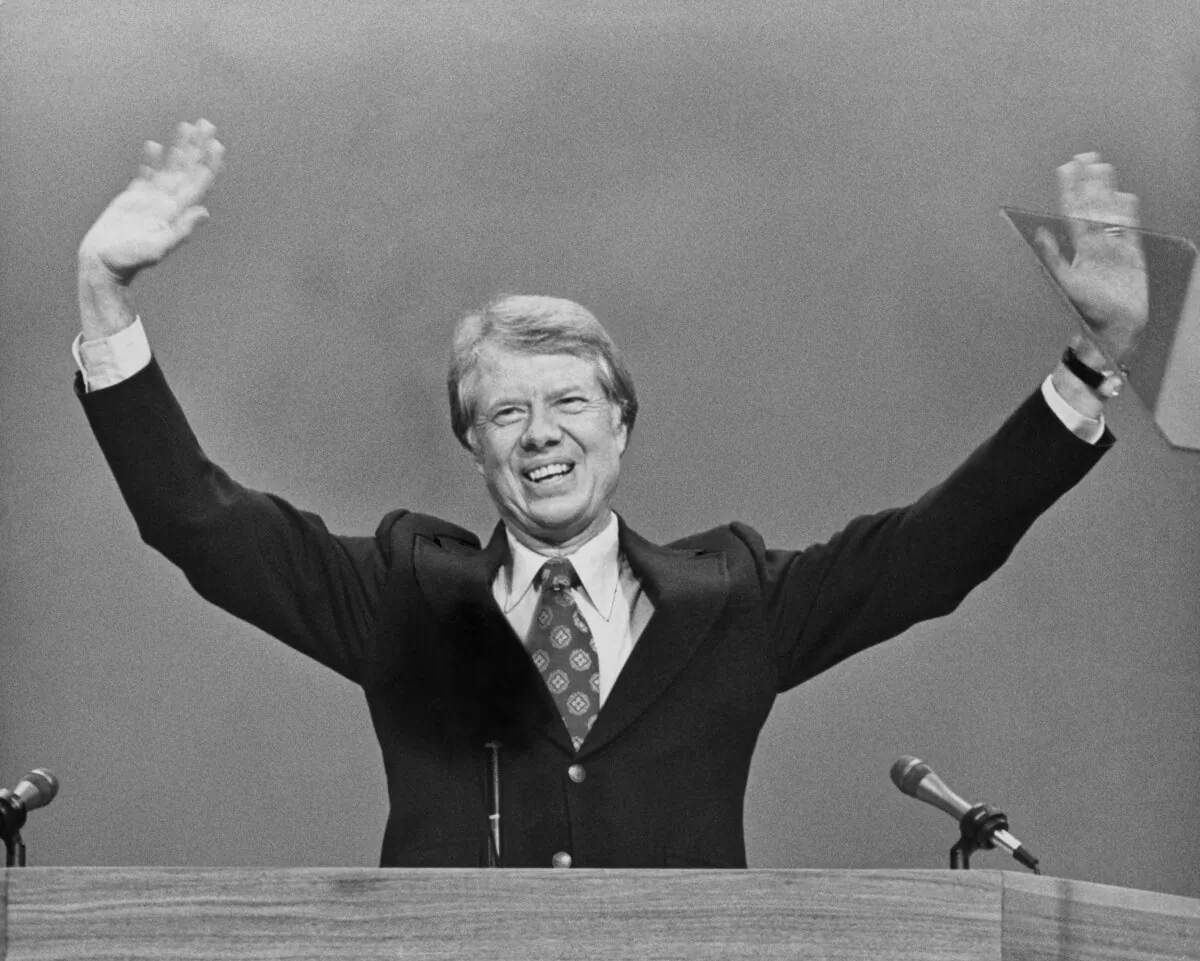 American politician Jimmy Carter smiles and waves to the auditorium at the close of the 1976 Democratic National Convention, where Carter was confirmed as the Democratic Party's presidential candidate, held at Madison Square Garden in New York City, on July 15, 1976.  (Archive Photos/Hulton Archive/Getty Images)