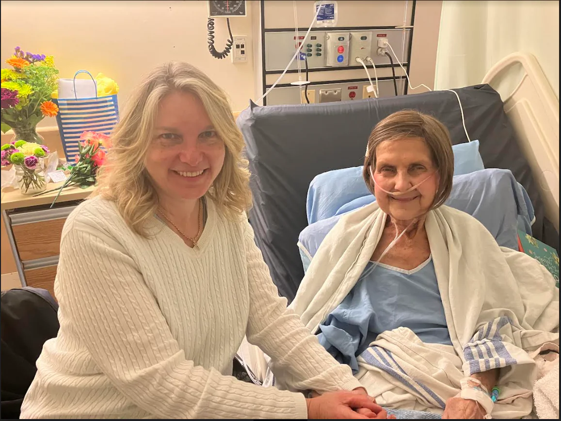 Delta Hospice Society president Angelina Ireland sits with cancer patient Pat Gray of Chilliwack, B.C., on July 25, 2024. Gray passed away in October 2024. (Photo courtesy Bronwyn Gray, Pat Gray's daughter)