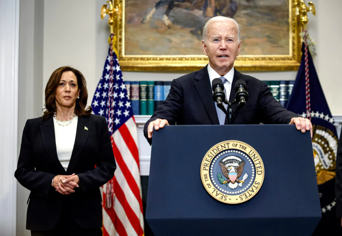 President Joe Biden delivers remarks as Vice President Kamala Harris looks on, at the White House on July 14, 2024. (Kevin Dietsch/Getty Images)