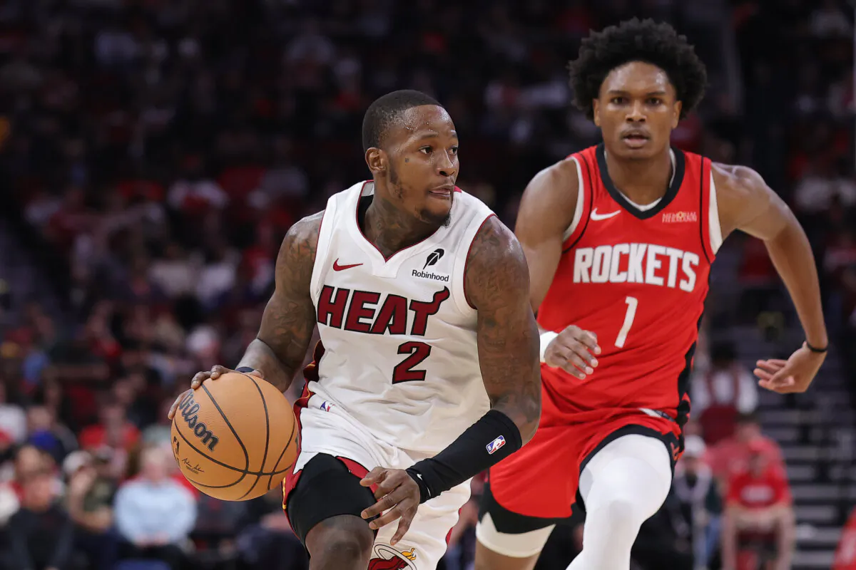 Terry Rozier (2) of the Miami Heat drives against Amen Thompson (1) of the Houston Rockets during the first half at Toyota Center in Houston, Texas, on Dec. 29, 2024. (Alex Slitz/Getty Images)