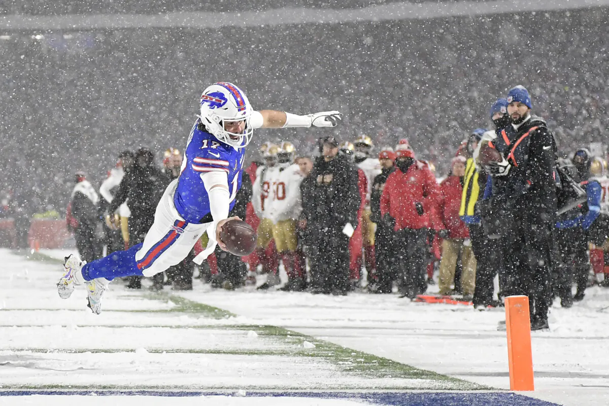 Buffalo Bills quarterback Josh Allen (17) dives for the end zone to score against the San Francisco 49ers during the second half of an NFL football game in Orchard Park, N.Y., on Dec. 1, 2024. (Adrian Kraus/AP Photo)