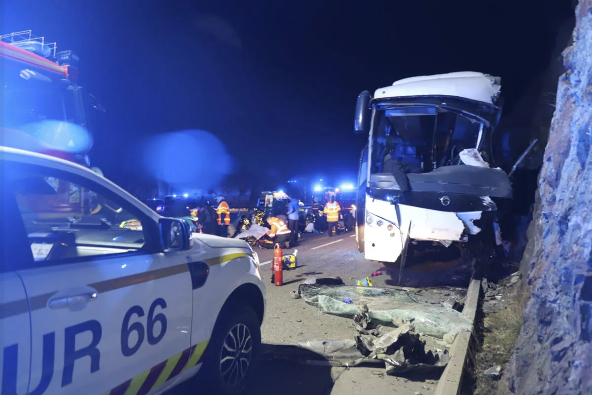 This photo provided on Dec. 2, 2024 by the regional rescue brigade show a bus that crashed Sunday evening, Dec. 1, 2024 near a ski resort in the Pyrenees mountains in southern France. (SDIS66 via AP)
