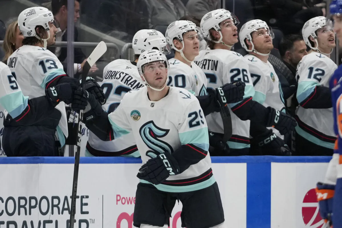 Seattle Kraken's Vince Dunn (29) reacts after scoring during the second period of an NHL hockey game against the New York Islanders, Thursday, Dec. 5, 2024, in Elmont, N.Y. (Frank Franklin II/AP Photo)