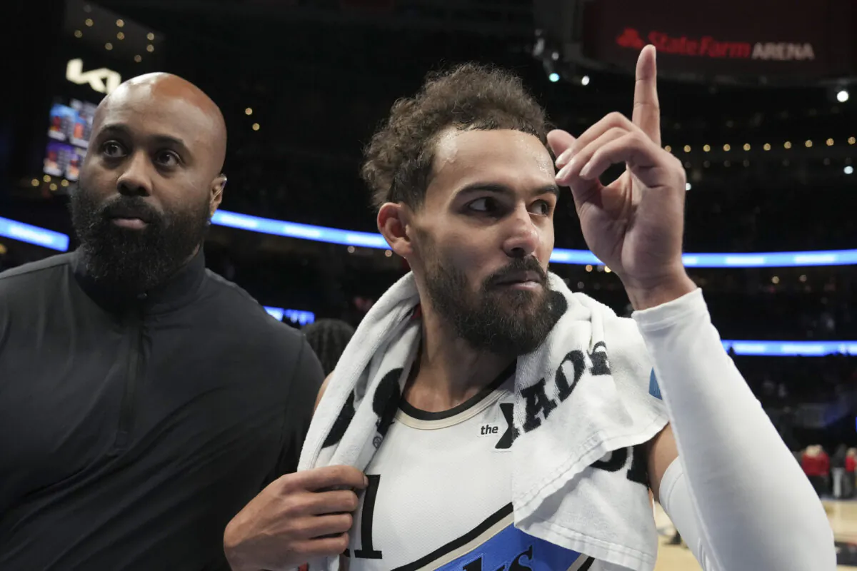 Atlanta Hawks guard Trae Young (11) walks off the court after an NBA basketball game against the Los Angeles Lakers in Atlanta, on Dec. 6, 2024. (Brynn Anderson/AP Photo)