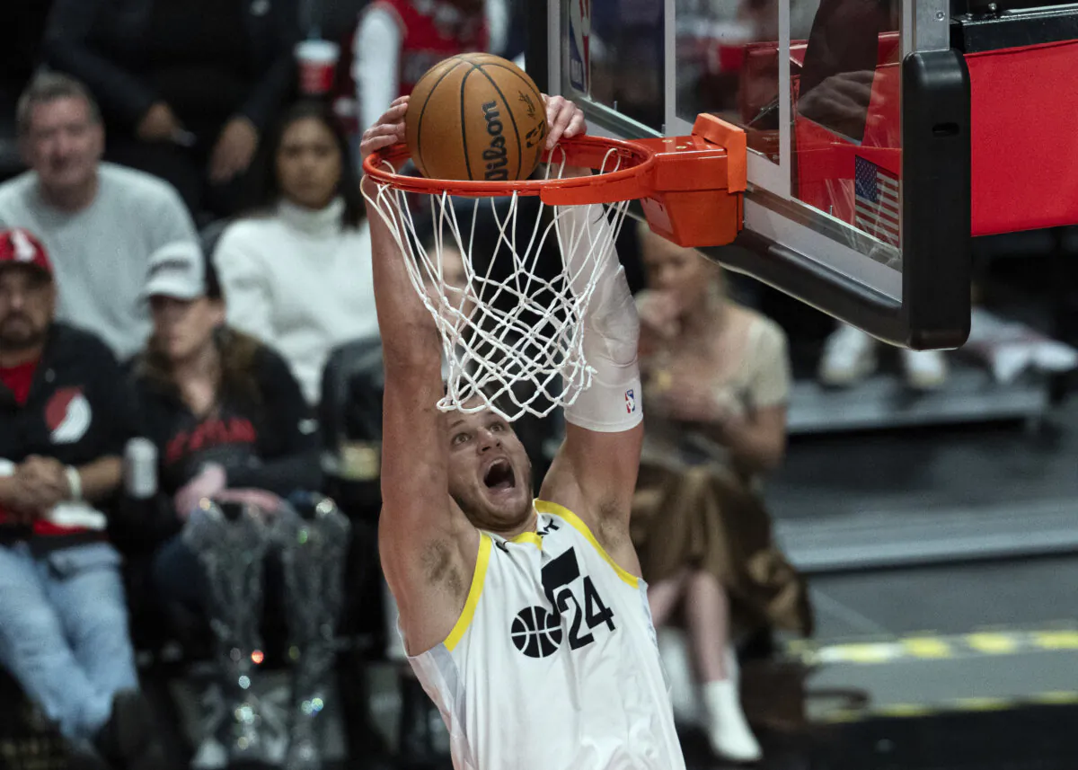Utah Jazz center Walker Kessler (24) dunks during the first half of an NBA basketball game against the Portland Trail Blazers in Portland, on Ore, Dec. 6, 2024. (Jenny Kane/AP Photo)
