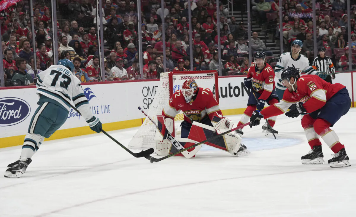 Florida Panthers goaltender Sergei Bobrovsky (72) and defenseman Dmitry Kulikov (7) defend the goal against San Jose Sharks left wing William Eklund (72), left, during the first period of an NHL hockey game, Saturday, Dec. 7, 2024, in Sunrise, Fla. (Lynne Sladky/AP Photo)