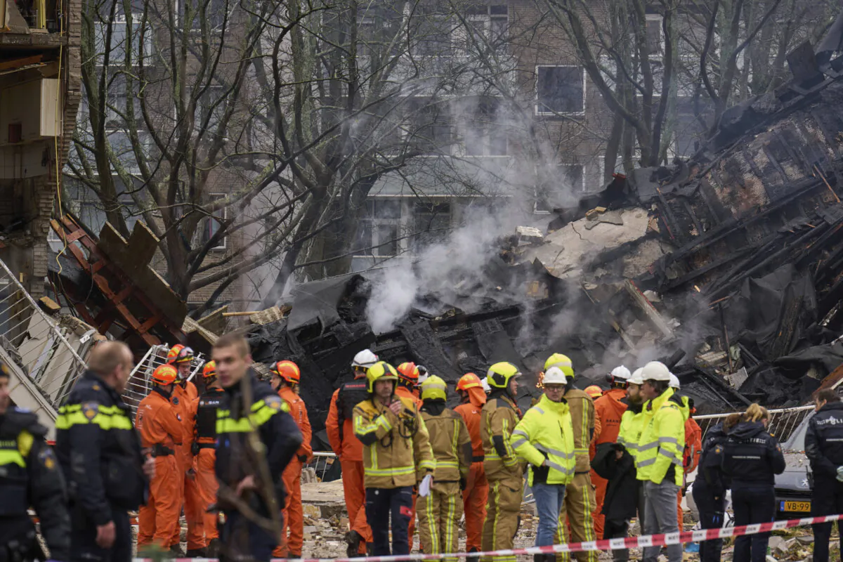 Firefighters stand by a building destruction at the site of an explosion which destroyed several apartments and injured multiple people, at The Hague, on Dec. 7, 2024. (Phil Nijhuis/AP Photo)