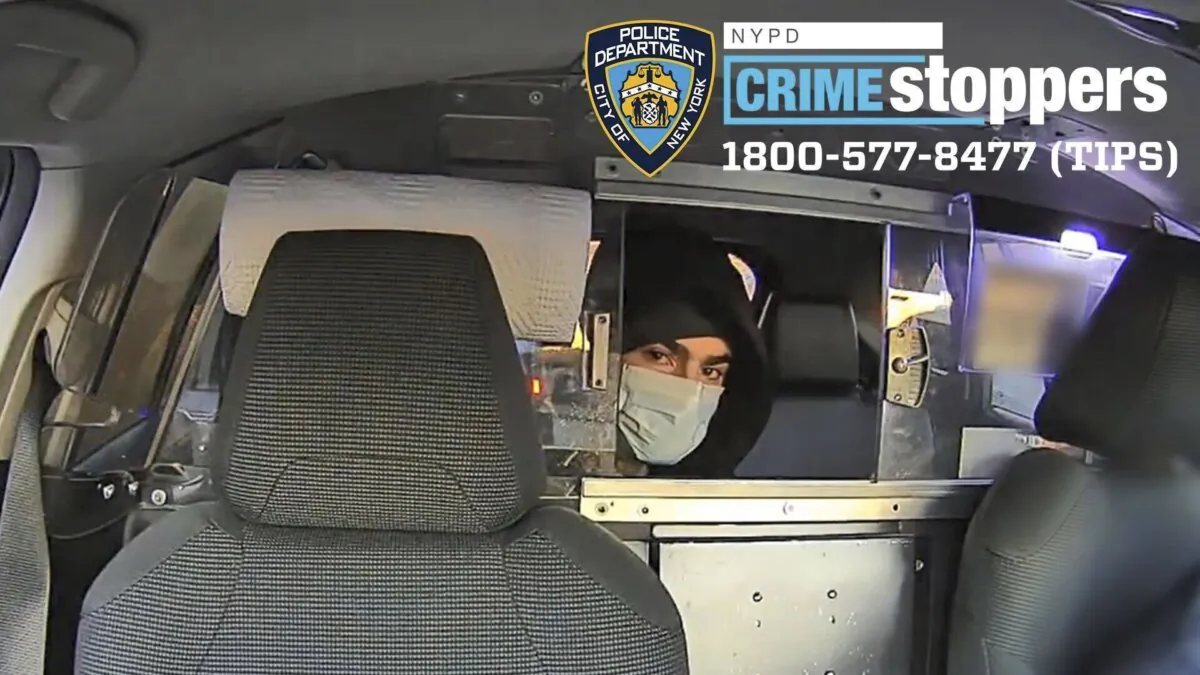 This undated photo released by the New York Police Department shows a suspect in the fatal shooting of UnitedHealthcare CEO Brian Thompson on Dec. 4, 2024, in a taxi. (NYPD via AP)