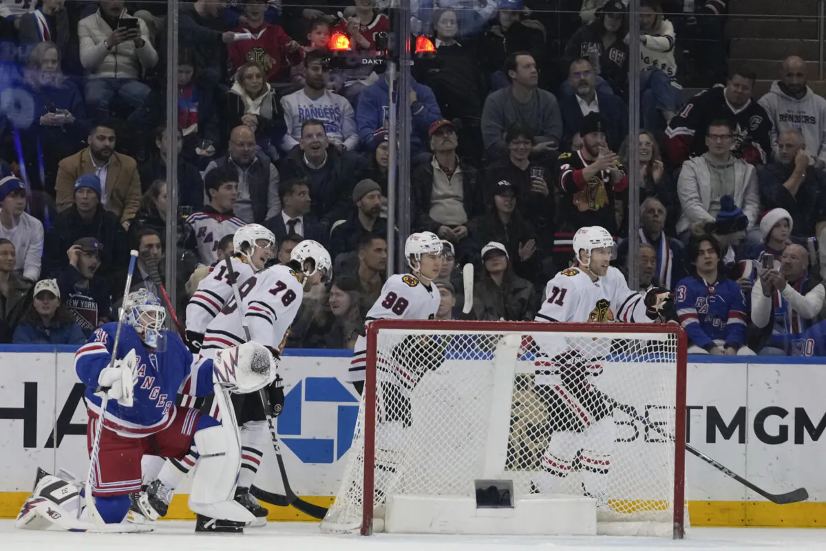 New York Rangers goaltender Igor Shesterkin, left, reacts as Chicago Blackhawks' Taylor Hall (71) celebrates with teammates Connor Bedard (98), TJ Brodie (78) and Kevin Korchinski (14) after scoring a goal during the second period of an NHL hockey game in New York, on Dec. 9, 2024. (Frank Franklin II/AP Photo)