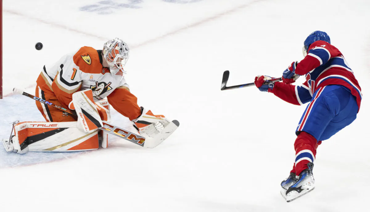 Montreal Canadiens' Patrik Laine (92) scores on Anaheim Ducks goaltender Lukas Dostal (1) during an overtime shootout in an NHL hockey game in Montreal, on Dec. 9, 2024. (Christinne Muschi/The Canadian Press via AP)