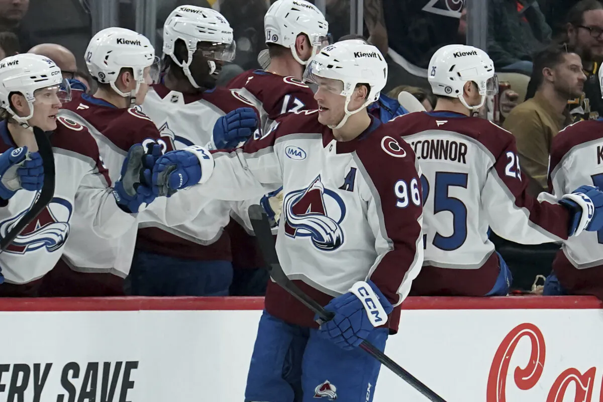 Colorado Avalanche's Mikko Rantanen (96) returns to the bench after scoring during the second period of an NHL hockey game against the Pittsburgh Penguins in Pittsburgh, on Dec. 10, 2024. (Matt Freed/AP Photo)