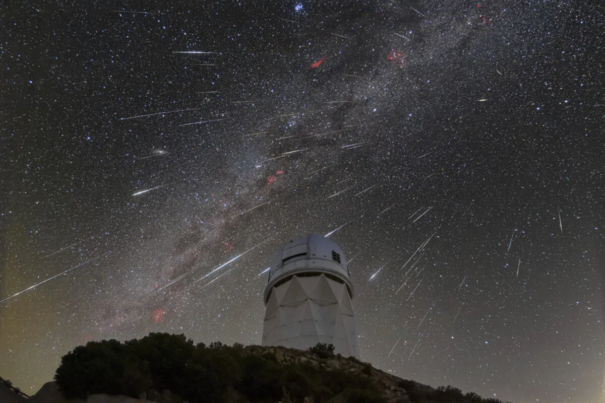 Meteors from the Geminid meteor shower streak across the sky above the Nicholas U. Mayall Telescope at Kitt Peak National Observatory (KPNO), located about 56 miles southwest of Tucson, in the Tohono O'odham Nation on Dec. 14, 2023. (NSF/NOIRLab via AP)