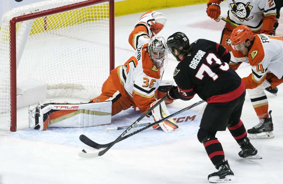 Ottawa Senators' Noah Gregor scores on Anaheim Ducks goaltender John Gibson during the first period of an NHL hockey game, Wednesday, Dec. 11, 2024 in Ottawa, Ontario. (Adrian Wyld/The Canadian Press via AP)