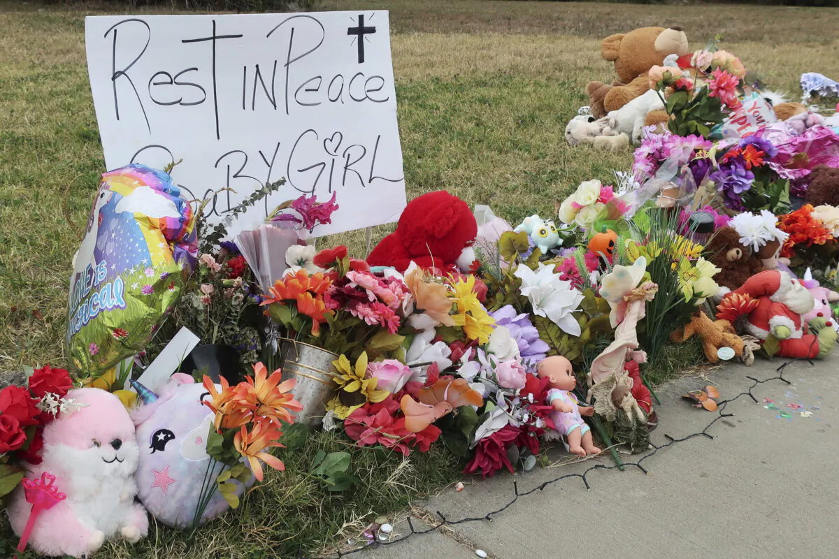 A memorial along a sidewalk along a vacant, wooded lot honors 5-year-old murder victim Zoey Felix, in Topeka, Kan., on Oct. 13, 2023. (John Hanna/AP Photo)