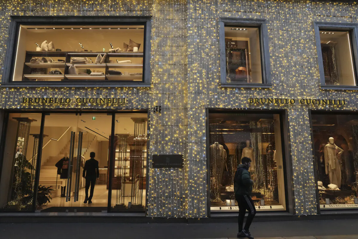 A man walks past a shop in Monte Napoleone street in Milan, Italy, on Dec. 12, 2024. (Antonio Calanni/AP Photo)