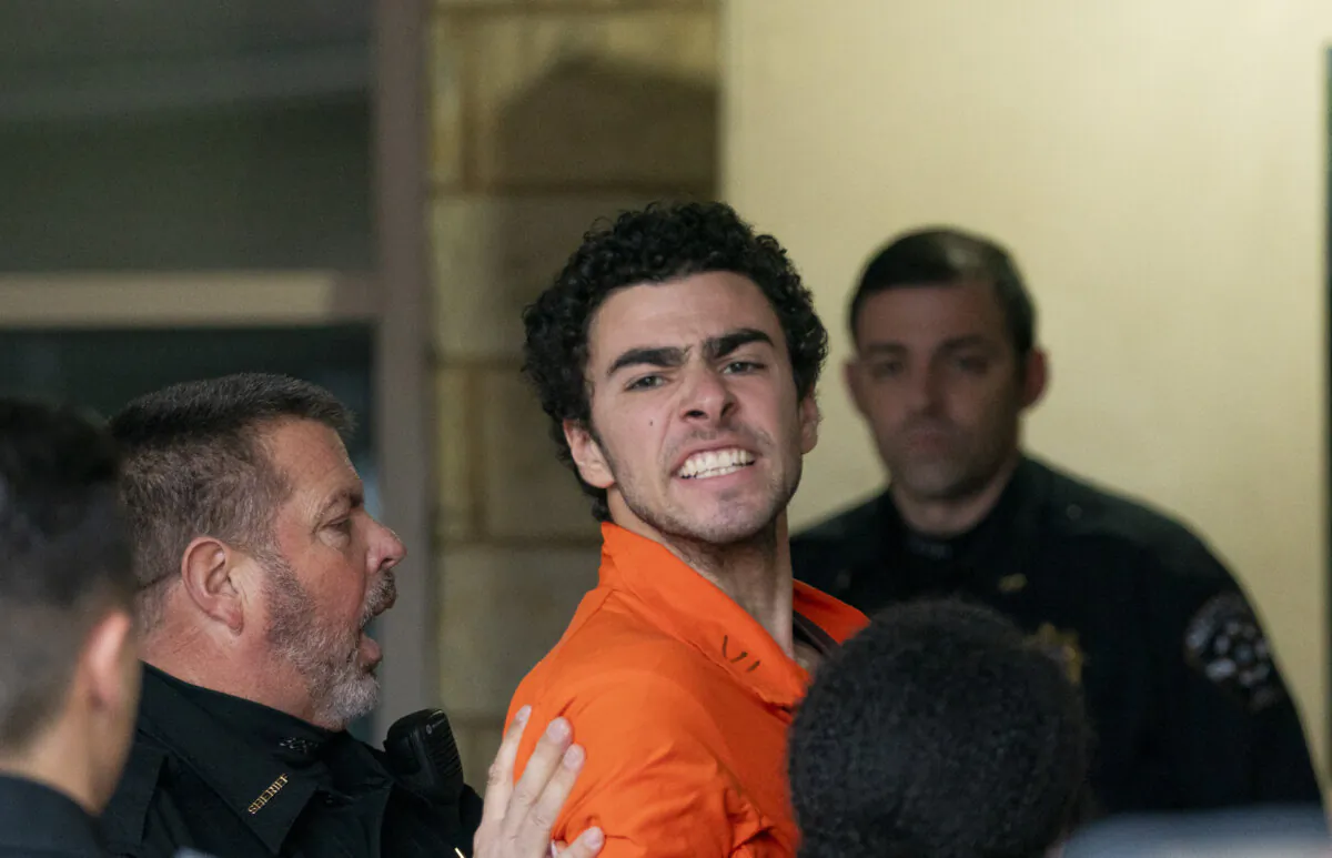 Murder suspect Luigi Mangione is taken into the Blair County Courthouse in Hollidaysburg, Pa., on Dec. 10, 2024. (Benjamin B. Braun/Pittsburgh Post-Gazette via AP)