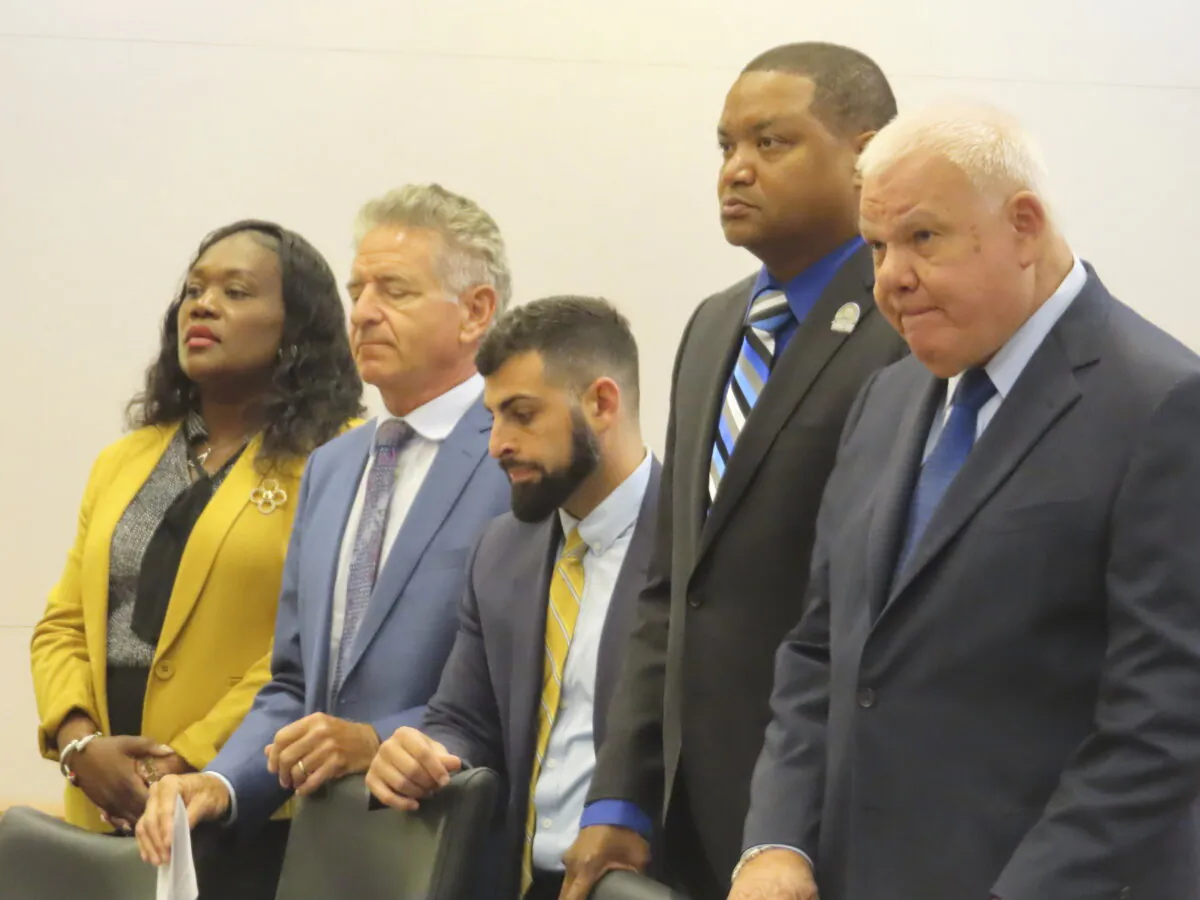 La'Quetta Small, the superintendent of schools for Atlantic City (L) and her husband, Atlantic City Mayor Marty Small Sr., (2nd R) stand with their lawyers and listen to a judge speaking during a court appearance in Mays Landing, N.J., on Oct. 10, 2024, on charges that they beat and abused their teenage daughter, charges that the couple deny. (Wayne Parry/AP Photo)