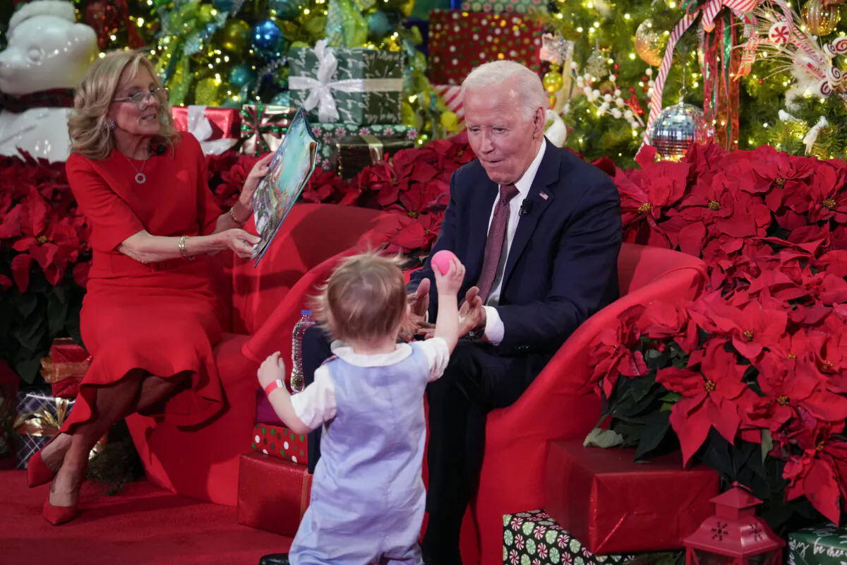 President Joe Biden and First Lady Jill Biden, as she reads 'Twas the Night Before Christmas, visit patients and families at the Children's National Hospital in Washington on Dec. 20, 2024. (Ben Curtis/AP Photo)