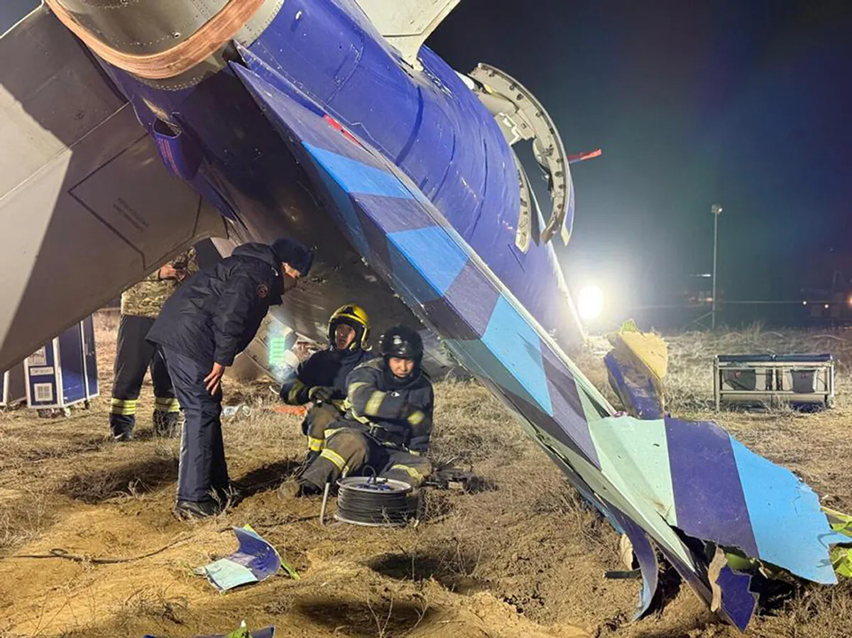 In this photo released by Kazakhstan's Emergency Ministry Press Service, rescuers work at the wreckage of Azerbaijan Airlines Embraer 190 on the ground near the airport of Aktau, Kazakhstan, on Dec. 26, 2024. (Kazakhstan's Emergency Ministry Press Service via AP)