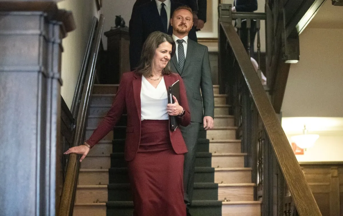 Alberta Premier Danielle Smith and Minister of Justice Mickey Amery make their way to the swearing in of her cabinet, in Edmonton on June 9, 2023. (The Canadian Press/Jason Franson)