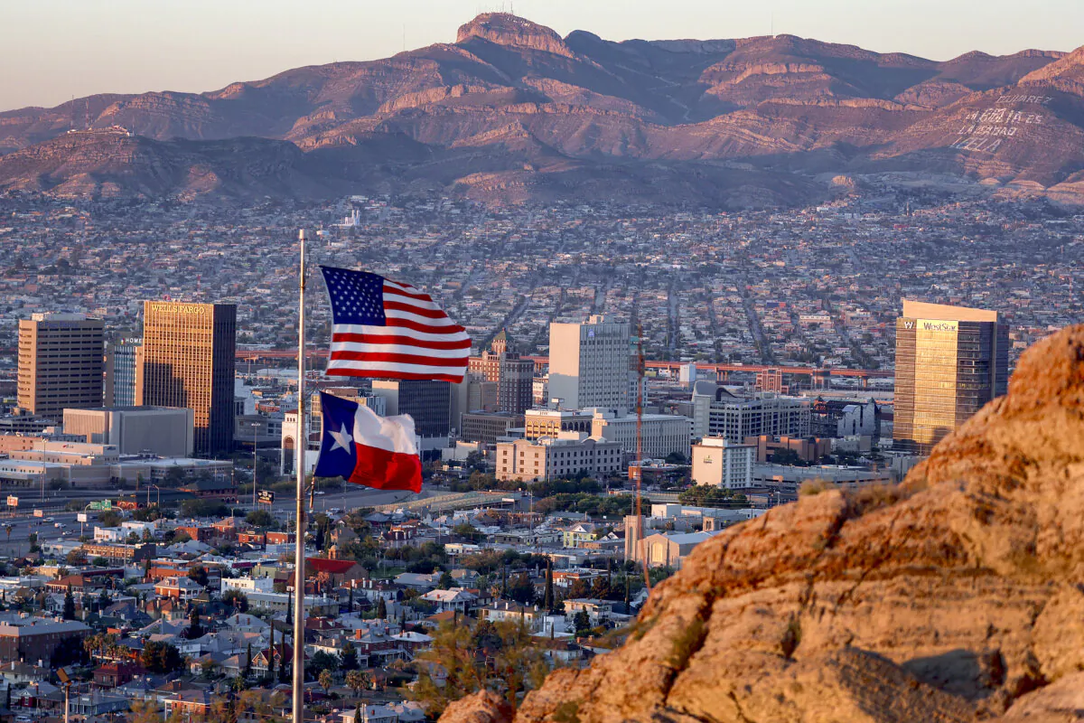 An American and Texas flag are seen flying in front of the skyline of El Paso and Ciudad Juarez in El Paso, Texas, on Sept. 23, 2022. (Joe Raedle/Getty Images)